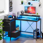 Scrivania angolare a L (120 cm) con luci LED, prese di corrente, porte USB e 3 cassetti